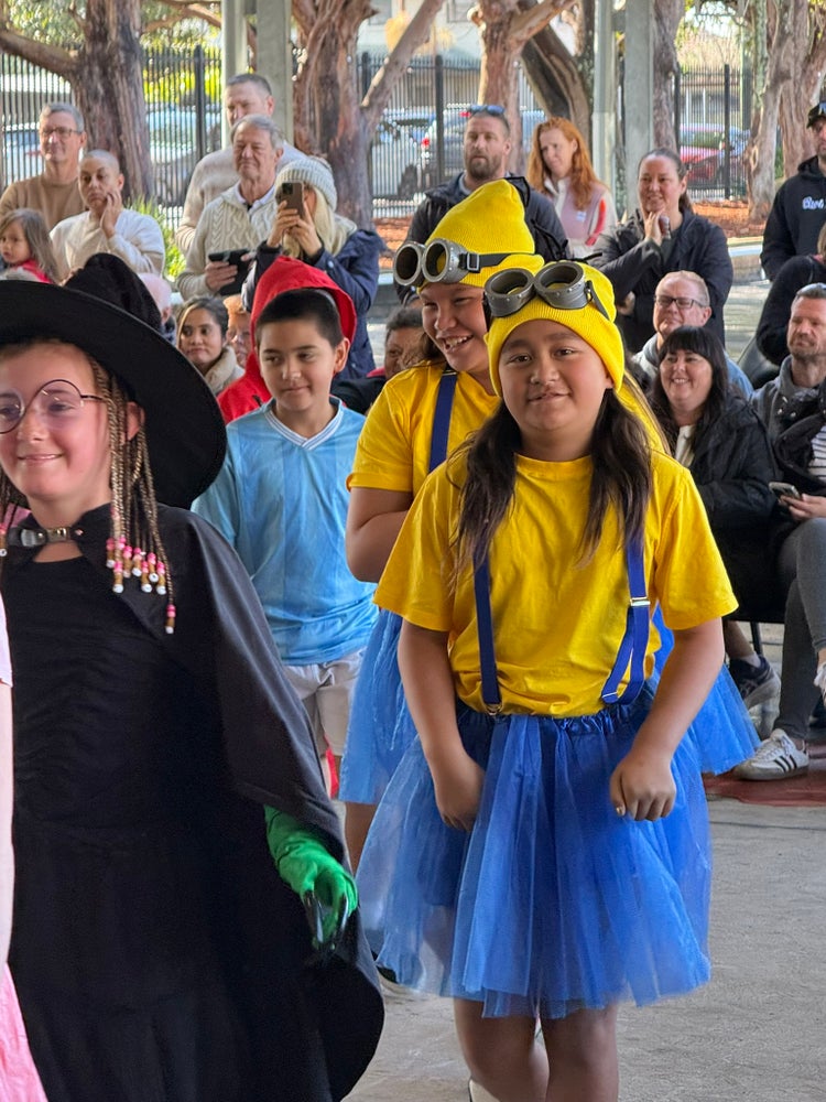 Students dressed as minions and witch at book week parade