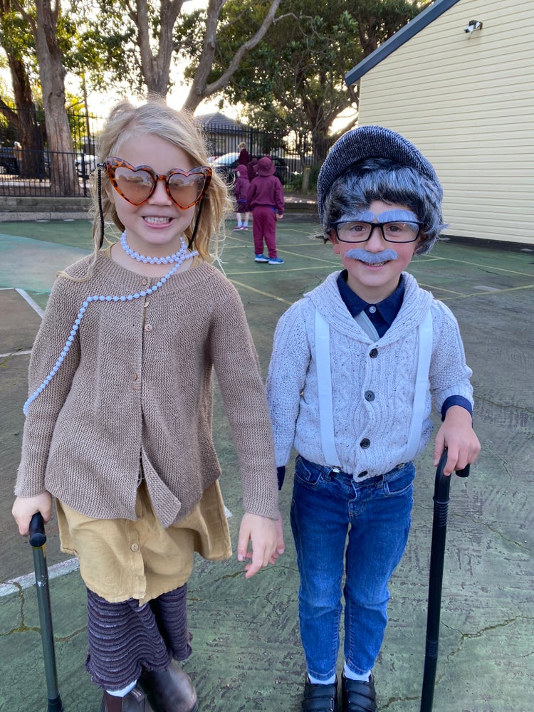 Kindergarten male and female students dressed up as old people