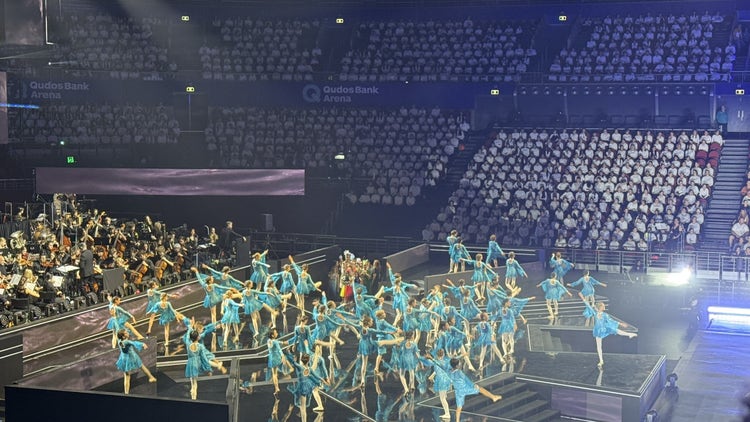Photo of arena at Homebush with many dancers in blue costume