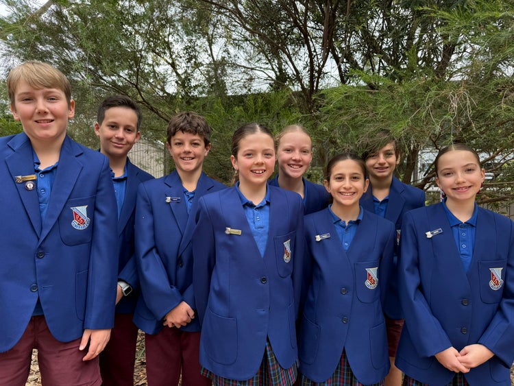 Photo of four male and four female Year 6 students dressed in blue blazers