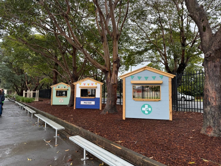 Photo of weatherboard shop fronts in a school playground