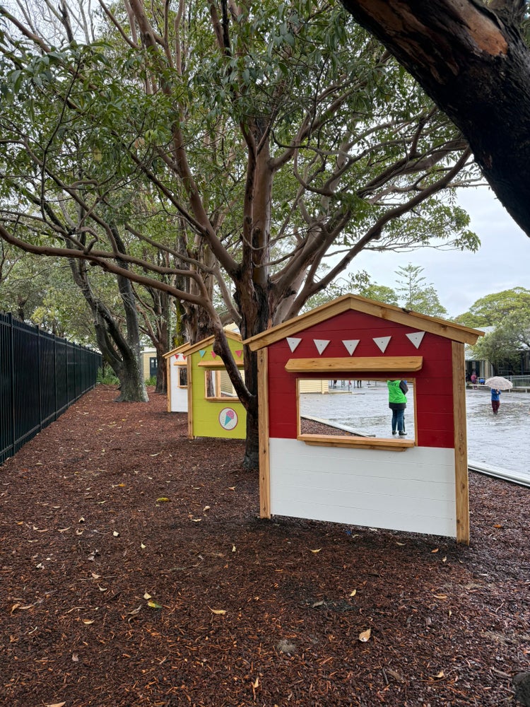Photo of weatherboard shop fronts in a school playground